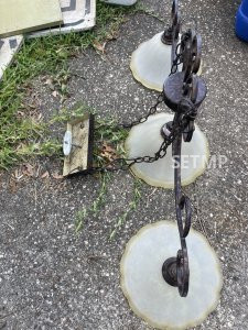 Hang from the ceiling light.